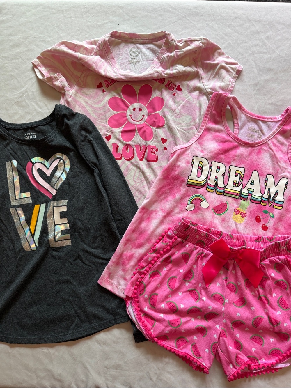 Bundle of Girls Clothing-1 long sleeve, 1 short sleeve and 1 pajama set.